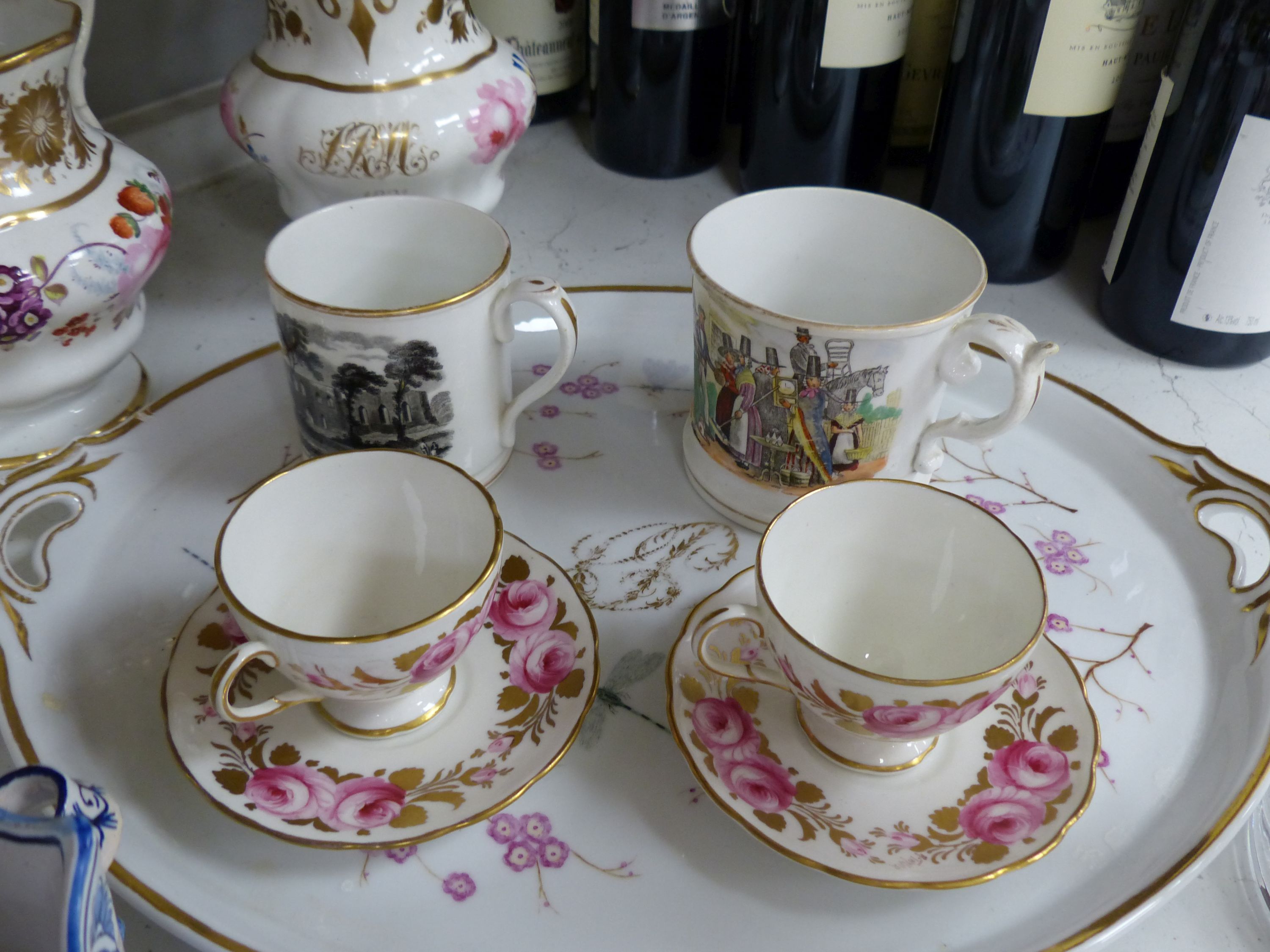 A Continental porcelain two handled tray painted with flowers and gilded with initials, a large English vase, a pair of Delft of vases, two Foley cup and saucers, two English jugs and other items